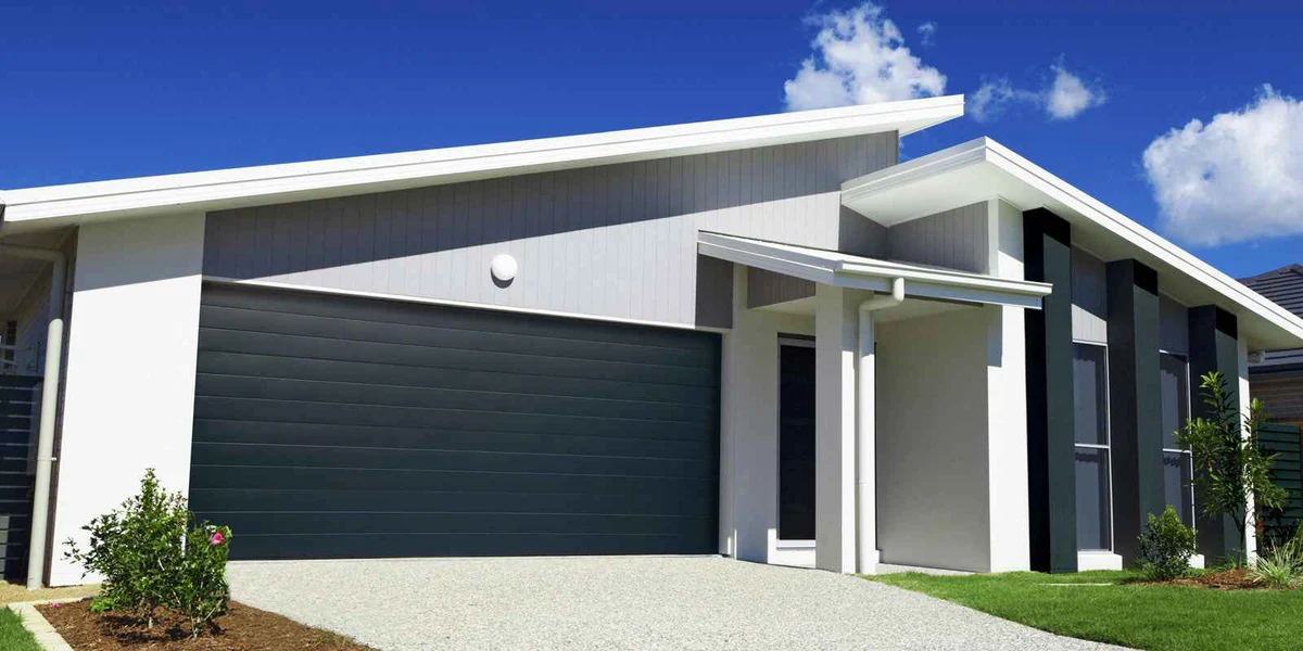 Sectional garage door installed on a modern home