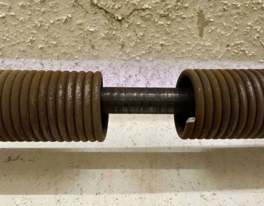 Broken garage door torsion spring