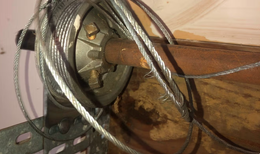 Garage door cable and drum adjustment
