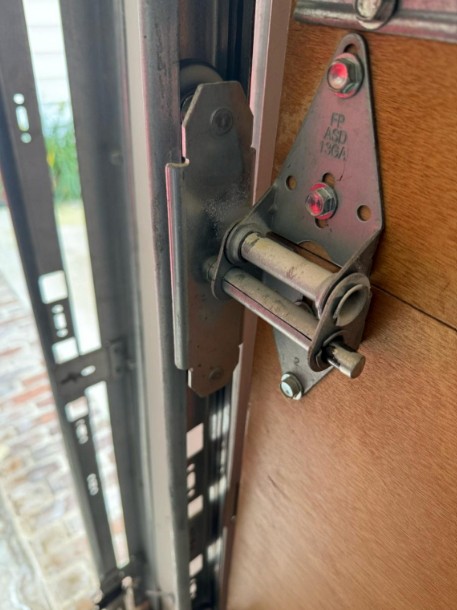 Garage door hinge and roller assembly