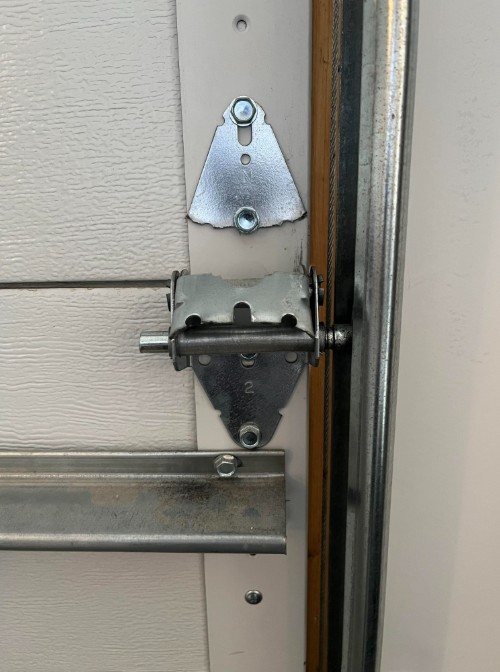 Damaged garage door hinge